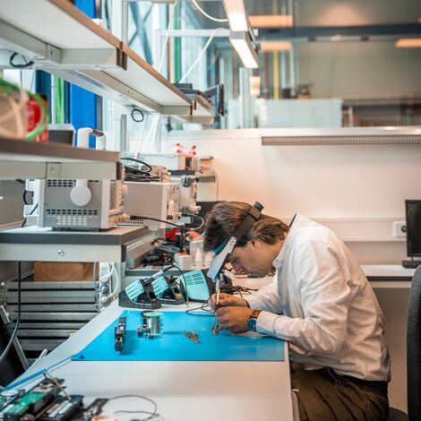 Expert working on small electronics in the Technology Centre.