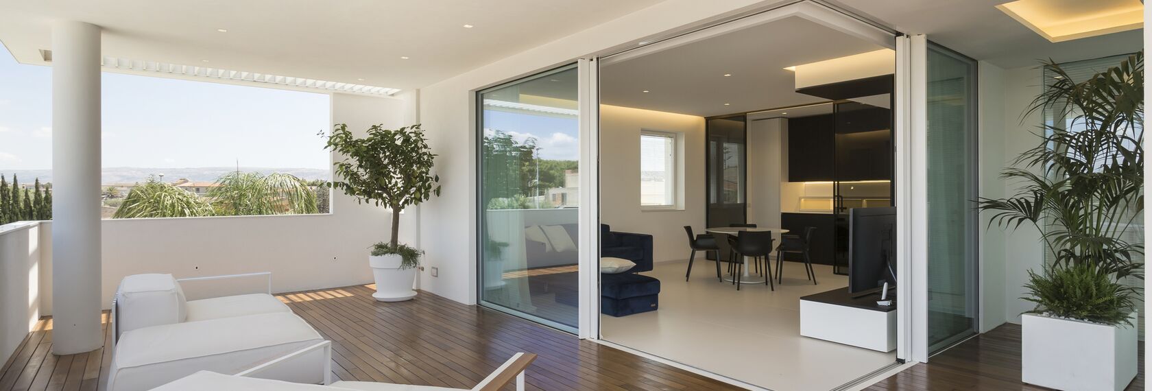 SlimPatio 68 Sliding & Folding, CS 77 Hidden Vent Windows, HiFinity Sliding & Folding and ConceptSystem 77 Windows - Casa D located in Ragusa, Italy