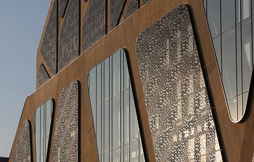 Glimmering glass façade of Belgian Court of Justice building, The Hasselaar.